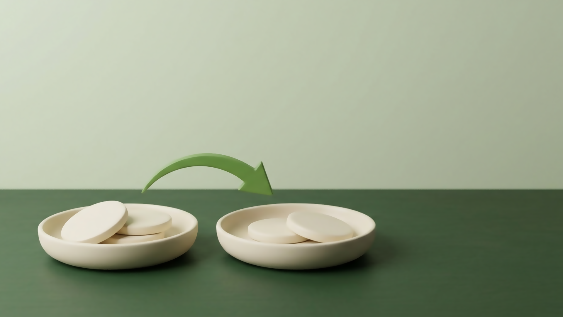 Two cream dishes on a green desk, each holding plain unmarked discs, with a single green arrow arcing from one dish to the other